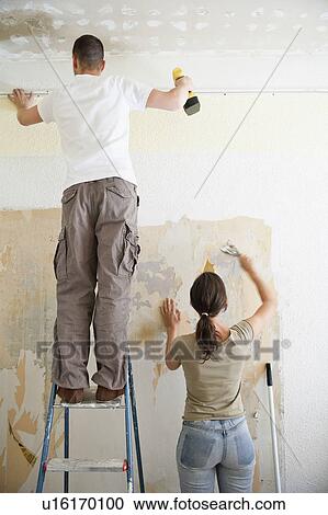 Young couple redecorating View Large Photo Image Stock Image - Young couple redecorating. Fotosearch