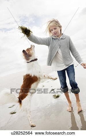 Young family on beach in autumn View Large Photo Image Picture - Young family on beach in autumn. Fotosearch