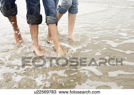 Young family on beach in autumn View Large Photo Image Stock Image - Young family on beach in autumn. Fotosearch