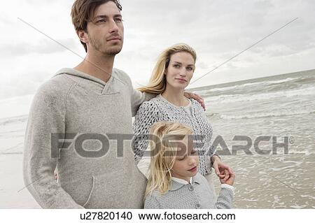 Young family on beach in autumn View Large Photo Image Stock Image - Young family on beach in autumn. Fotosearch