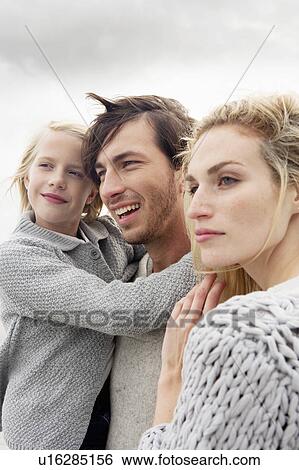 Young family on beach in autumn View Large Photo Image Stock Photograph - Young family on beach in autumn. Fotosearch