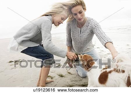 Young family on beach in autumn View Large Photo Image Stock Photograph - Young family on beach in autumn. Fotosearch