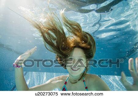 Stock Photography - Young girl in swimming pool. Fotosearch