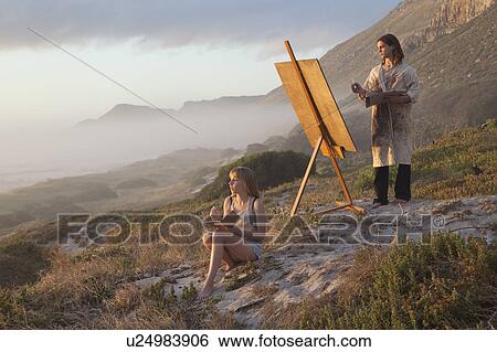 Young man and woman painting View Large Photo Image Stock Photograph - Young man and woman painting. Fotosearch