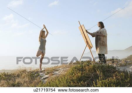 Young man painting girl in landscape View Large Photo Image Picture - Young man painting girl in landscape. Fotosearch