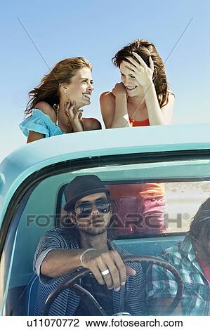 Young people traveling in pickup truck View Large Photo Image Stock Image - Young people traveling in pickup truck. Fotosearch