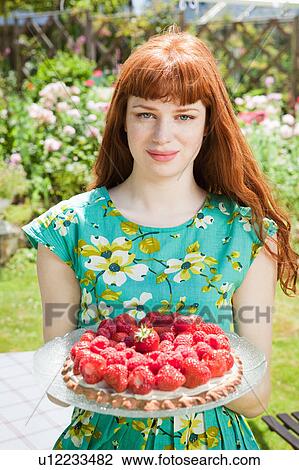 young woman holding strawberry tart. View Large Photo Image Stock Image - young woman holding strawberry tart.. Fotosearch