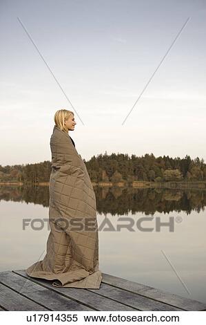 Young woman standing on jetty, enjoying View Large Photo Image Stock Photography - Young woman standing on jetty, enjoying. Fotosearch