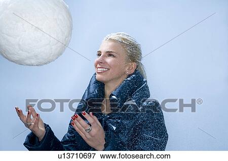Young woman throws large snowball View Large Photo Image Stock Photo - Young woman throws large snowball. Fotosearch