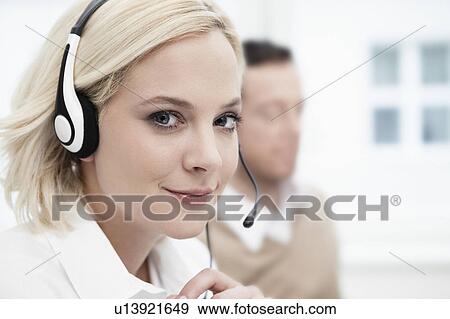 Young woman with headset View Large Photo Image Stock Photo - Young woman with headset. Fotosearch