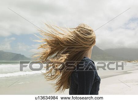 Young womans hair blowing in wind View Large Photo Image Picture - Young womans hair blowing in wind. Fotosearch