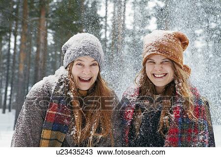 Young women outside in heavy snow View Large Photo Image Stock Image - Young women outside in heavy snow. Fotosearch