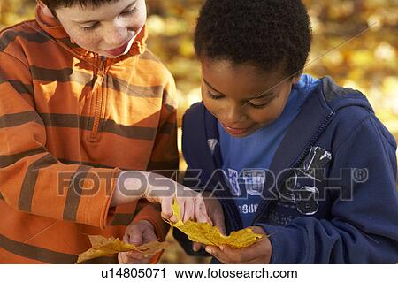 2 boys outdoors View Large Photo Image Stock Image - 2 boys outdoors. Fotosearch
