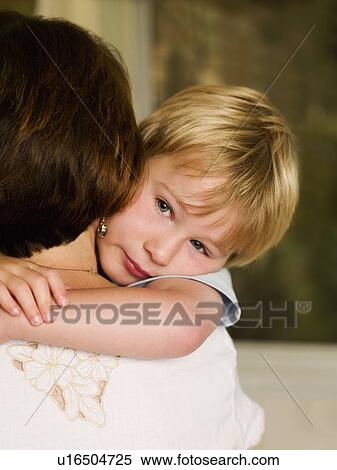 A boy hugging his mum View Large Photo Image Stock Photography - A boy hugging his mum. Fotosearch