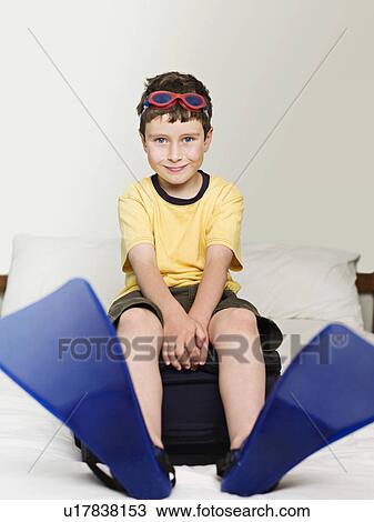 A boy wearing goggles and flippers View Large Photo Image Stock Image - A boy wearing goggles and flippers. Fotosearch