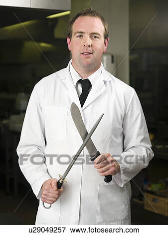 A butcher sharpening his knife View Large Photo Image Stock Photo - A butcher sharpening his knife. Fotosearch