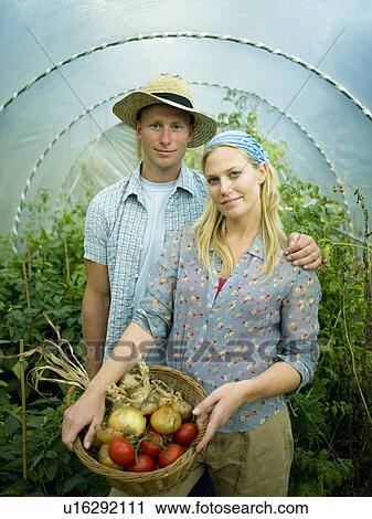 A couple in a green house View Large Photo Image Stock Image - A couple in a green house. Fotosearch