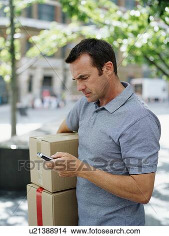A courier delivers parcels View Large Photo Image Picture - A courier delivers parcels. Fotosearch