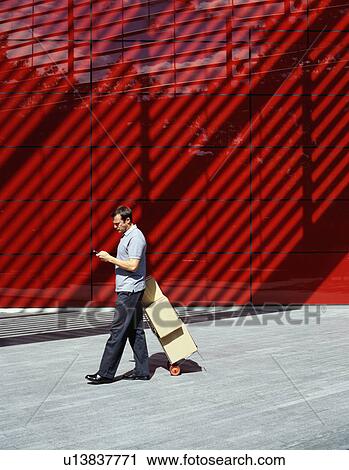 A courier delivers parcels View Large Photo Image Stock Image - A courier delivers parcels. Fotosearch