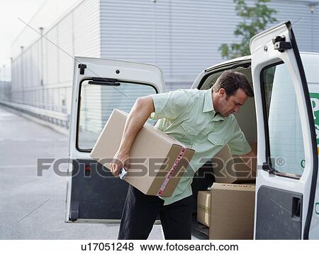 Stock Photo - A courier delivers parcels. Fotosearch
