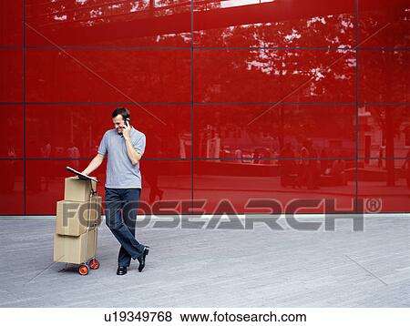 A courier delivers parcels View Large Photo Image Stock Photo - A courier delivers parcels. Fotosearch
