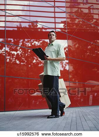 Stock Photograph - A courier delivers parcels. Fotosearch
