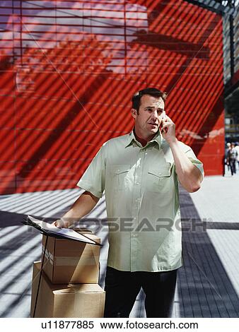 A courier delivers parcels View Large Photo Image Stock Photography - A courier delivers parcels. Fotosearch
