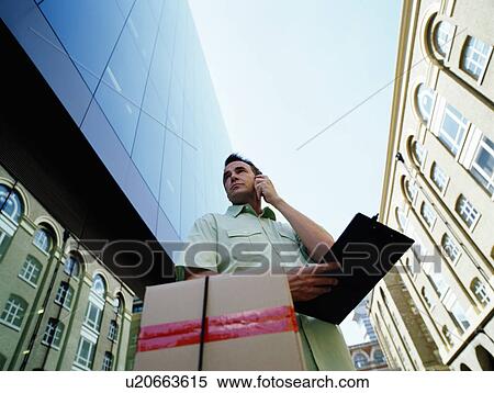 A courier delivers parcels View Large Photo Image Stock Photography - A courier delivers parcels. Fotosearch
