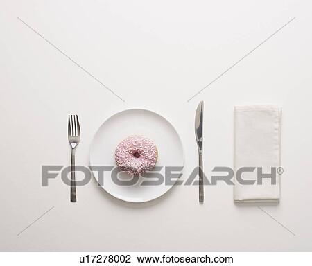 Stock Image - A doughnut on a plate. Fotosearch