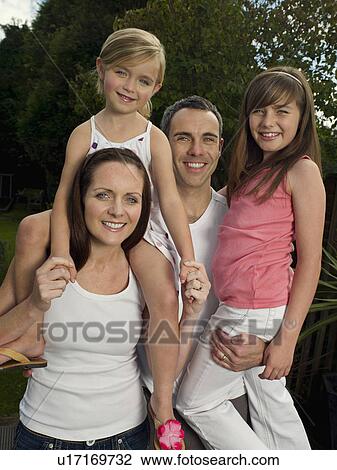 Stock Image - A family portrait in the garden. Fotosearch