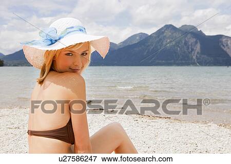Stock Photo - A girl smiling towards camera. Fotosearch