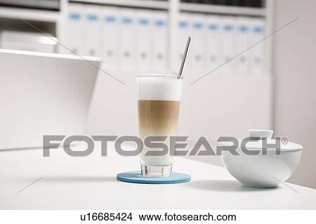 Picture - A glass of Latte Macchiato. Fotosearch