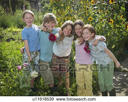 Stock Photo - A group of friends in a garden. Fotosearch