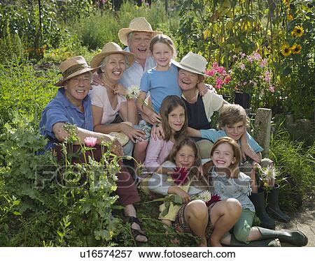 Stock Photo - A group portrait in a garden. Fotosearch