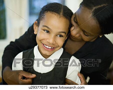A mother hugging her little girl View Large Photo Image Stock Image - A mother hugging her little girl. Fotosearch