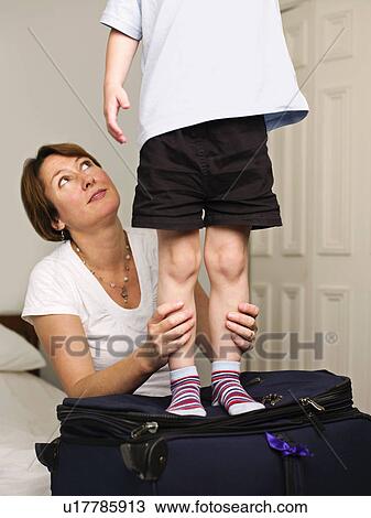 Stock Image - A mother looking up at her son. Fotosearch