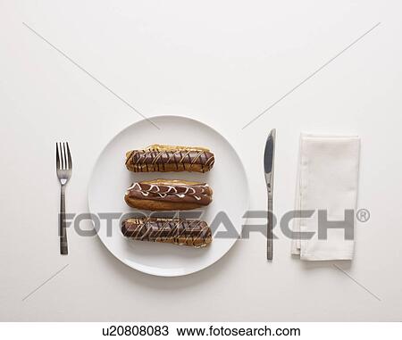 Stock Image - A plate of cream cakes. Fotosearch