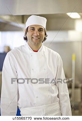 Stock Image - A portrait of a chef in a kitchen. Fotosearch
