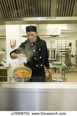 Stock Image - A portrait of a chef in a kitchen. Fotosearch