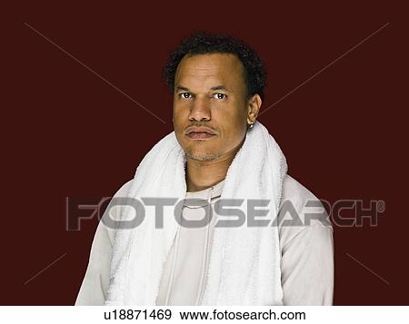 Stock Photo - A portrait of a male with towel. Fotosearch