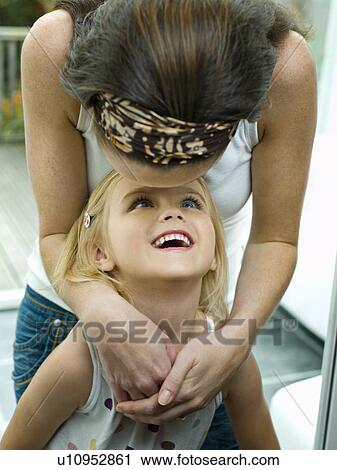 Stock Image - A portrait of a mother and daughter. Fotosearch