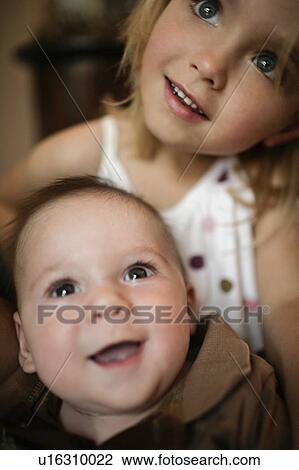 A portrait of a sister and young brother View Large Photo Image Stock Image - A portrait of a sister and young brother. Fotosearch