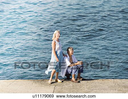 A senior couple on the quay side View Large Photo Image Stock Photo - A senior couple on the quay side. Fotosearch