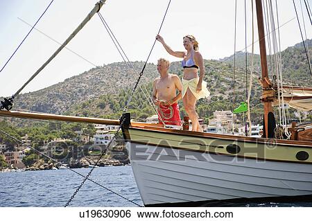 Stock Photograph - A senior couple sailing. Fotosearch