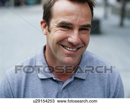 A smiling courier View Large Photo Image Stock Image - A smiling courier. Fotosearch