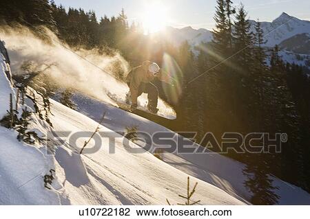 A snowboarder jumping View Large Photo Image Stock Image - A snowboarder jumping. Fotosearch