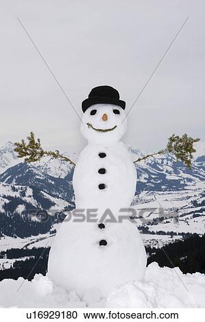 A snowman in a winter scene View Large Photo Image Stock Image - A snowman in a winter scene. Fotosearch