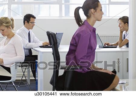 A working office scene View Large Photo Image Stock Image - A working office scene. Fotosearch