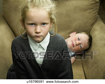 A young girl and her brother View Large Photo Image Stock Image - A young girl and her brother. Fotosearch