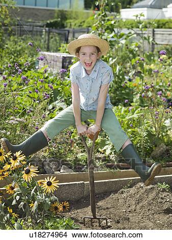 Picture - A young girl in a allotment garden. Fotosearch